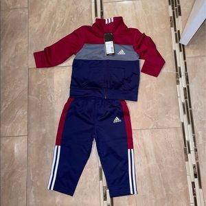Brand new toddler Adidas jogging suit tickets still attached. Size 12 months